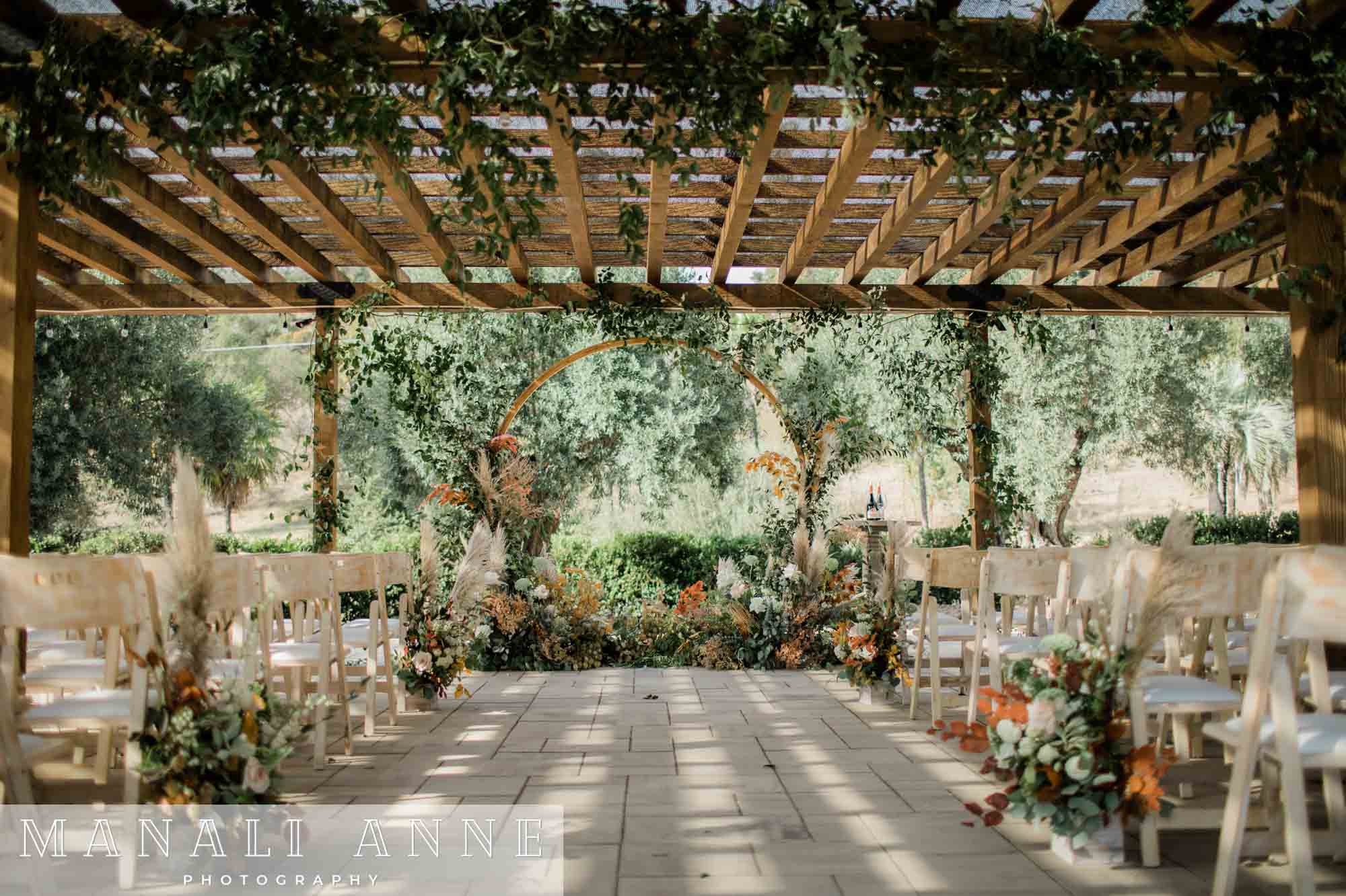 Wedding ceremony set-up at Chateau St. Jean Winery, Kenwood, CA, Floral wedding decor