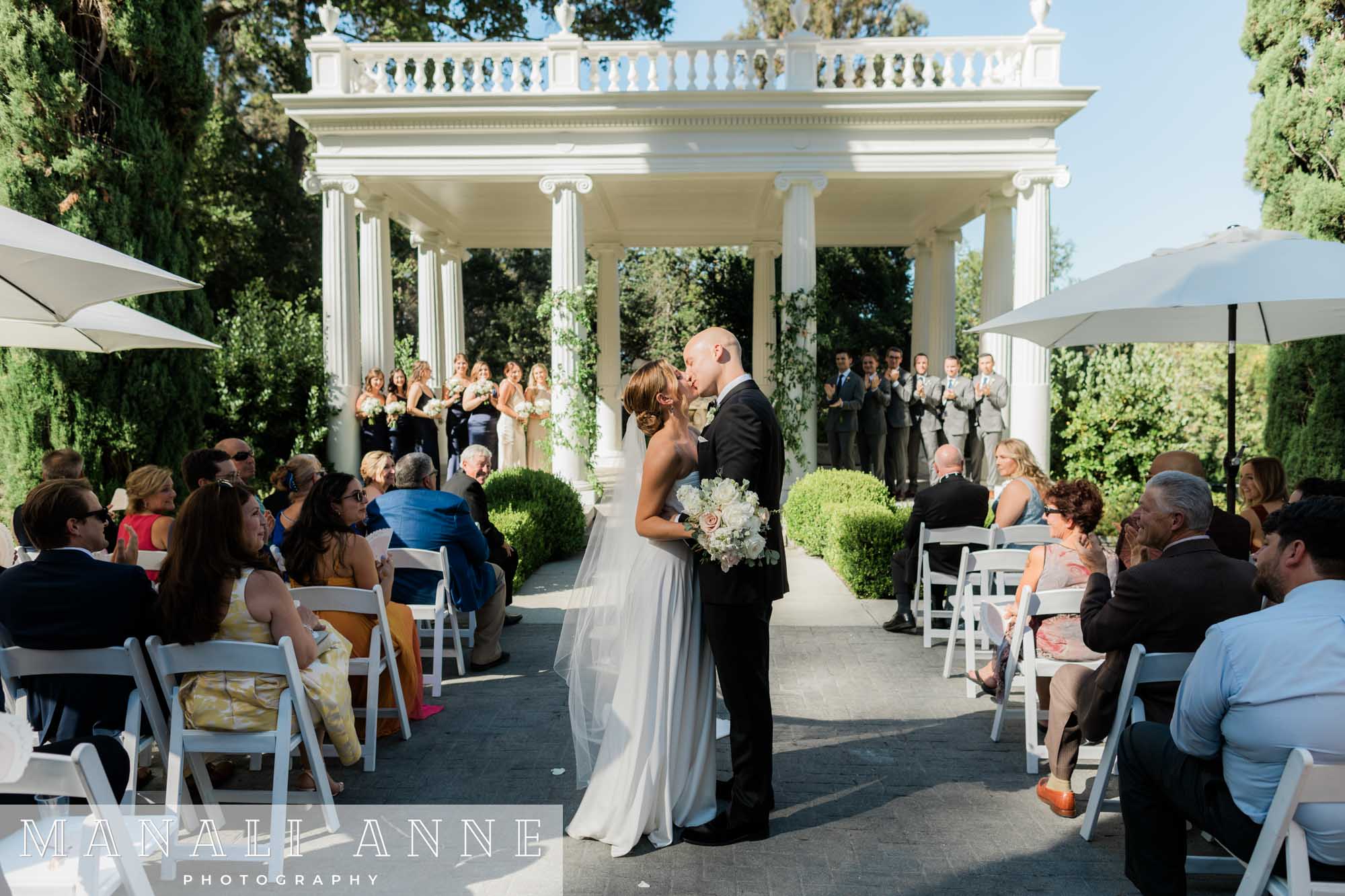 Kiss after Villa Montalvo Wedding ceremony in Italian Garden