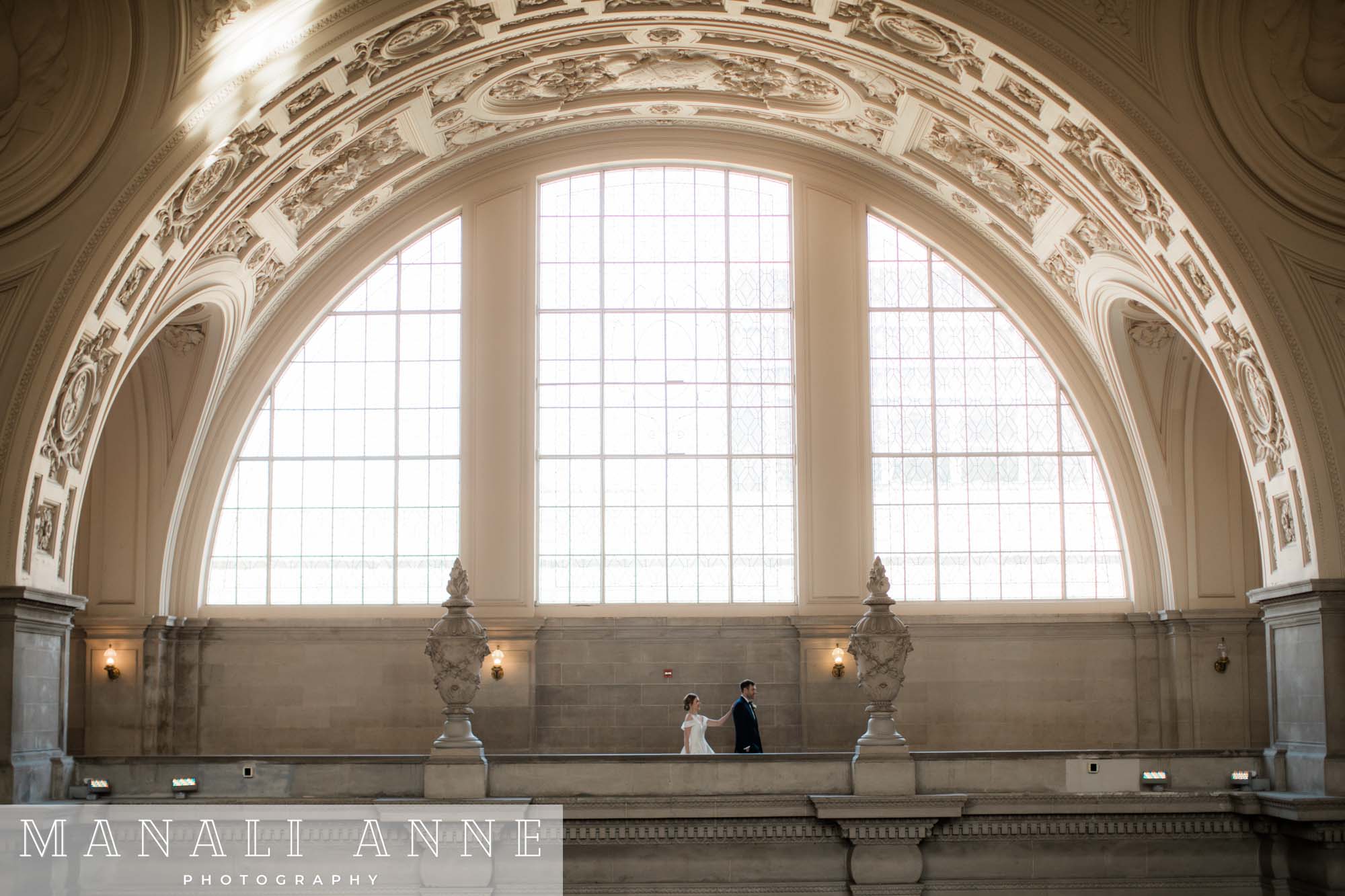 A wedding couple's first look on the 4th floor north gallery at san francisco city hall