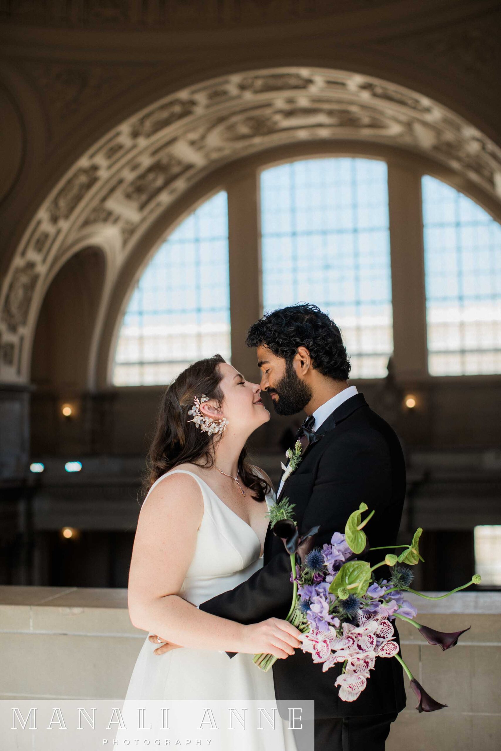 A wedding couple on the 4th floor of San francisco city hall